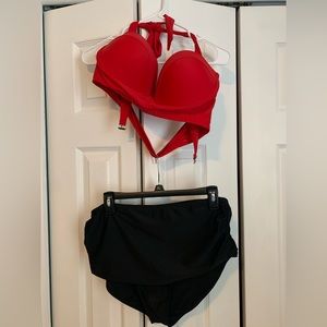 Red pin up girl style bikini top with black bottoms.
